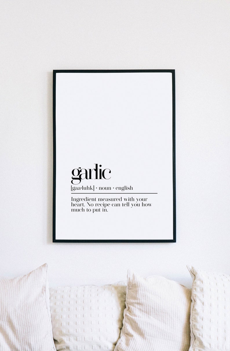 May include: Black and white printable wall art with the definition of garlic. The text reads "garlic [gaa-luhk] noun english Ingredient measured with your heart. No recipe can tell you how much to put in."
