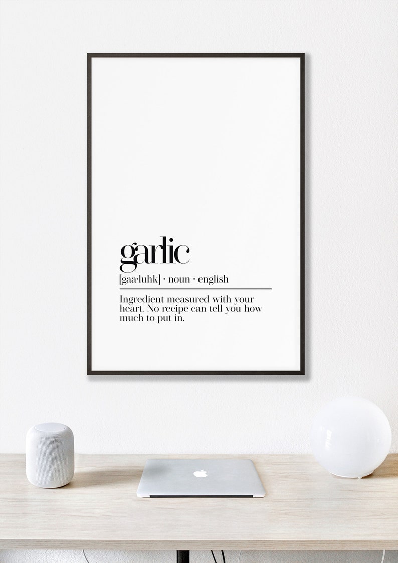 May include: Black and white printable wall art with the word "garlic" defined as an ingredient measured with your heart. The text reads "garlic [gaa-luhk] noun english Ingredient measured with your heart. No recipe can tell you how much to put in."