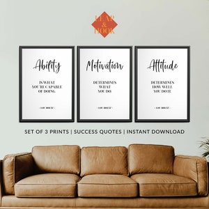 May include: A set of three black framed prints with white backgrounds and black text. The prints feature motivational quotes about ability, motivation, and attitude. The quotes are attributed to Lou Holtz. The prints are arranged in a row on a wall above a brown leather sofa.