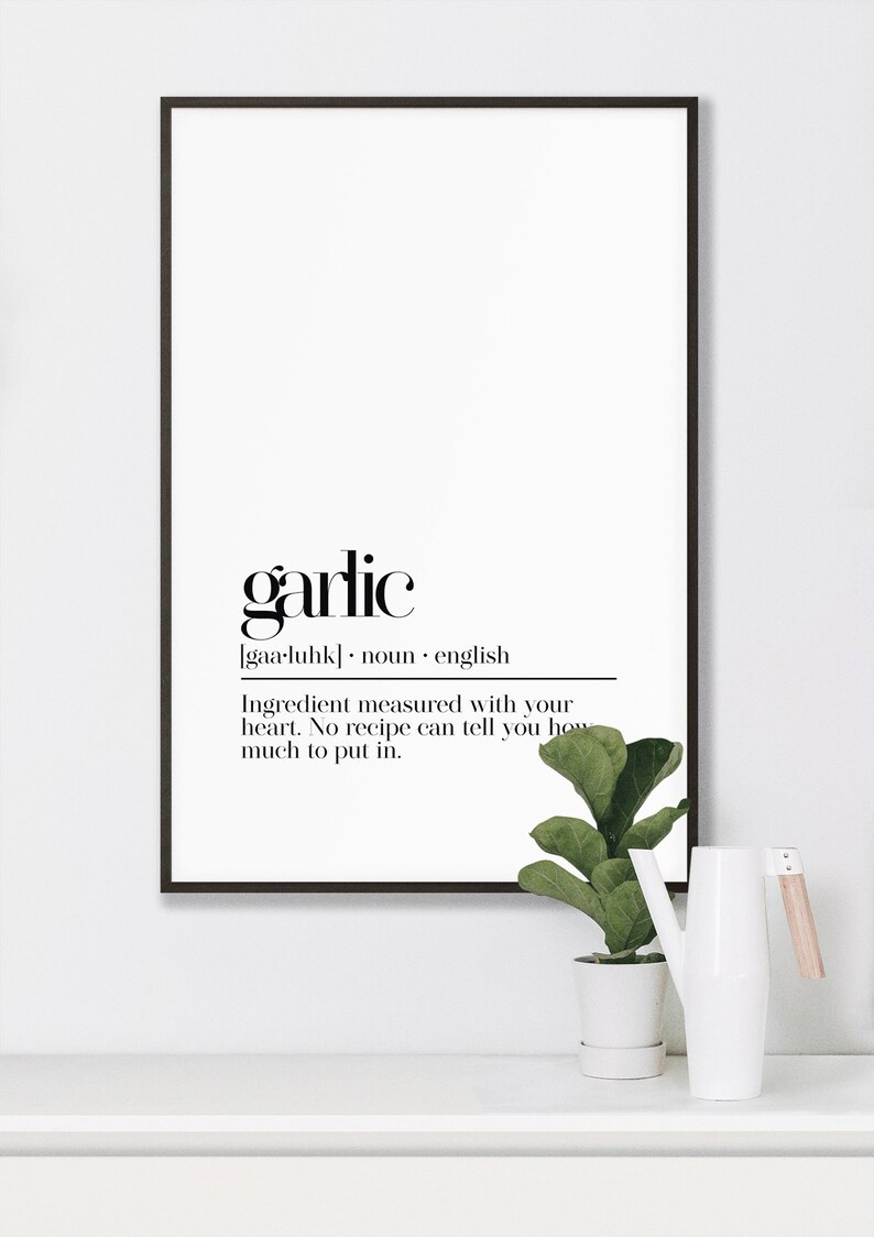 May include: Black and white printable wall art with the definition of the word "garlic". The definition reads: "[gaa-luhk] noun english Ingredient measured with your heart. No recipe can tell you how much to put in."