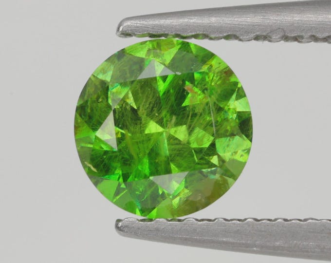 Lab-Certified, Russian Origin, .64 Carat, Round Cut, Demantoid Garnet with RARE Horsetail Inclusions