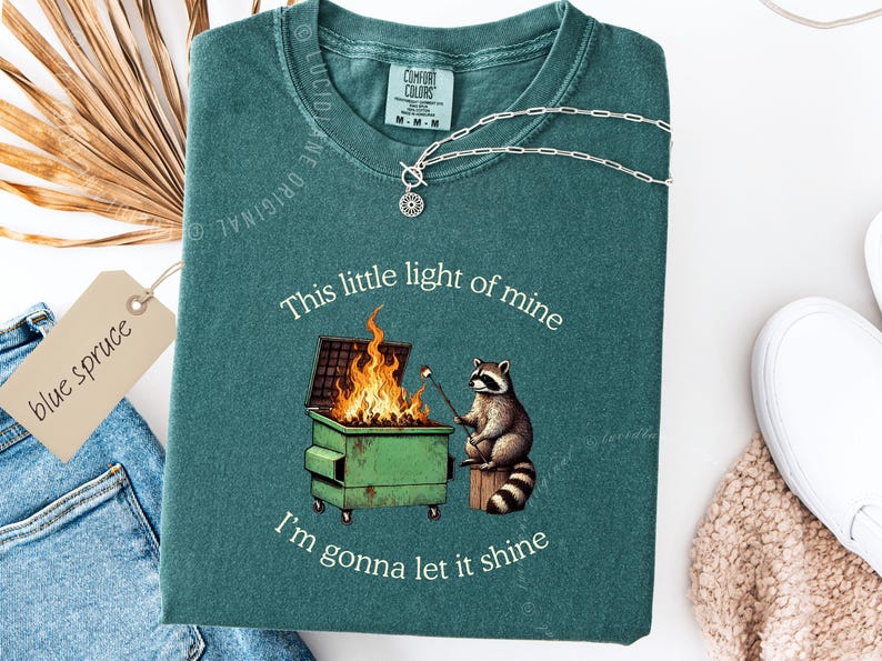 funny dumpster fire shirt, dumpster fire raccoon shirt, raccoon dumpster fire meme tee, trash panda shirt, funny raccoon graphic tee, this little light of mine parody shirt, chaotic raccoon shirt, anxiety humor shirt, funny meme t shirt, roasting marshmallow raccoon tee, comfort colors funny shirt, ironic humor tee, relatable humor shirt, chaos meme shirt, funny animal meme shirt, satirical graphic tee, unhinged raccoon tee, funny gift shirt, mental health meme tee, sarcastic tee, viral shirt
