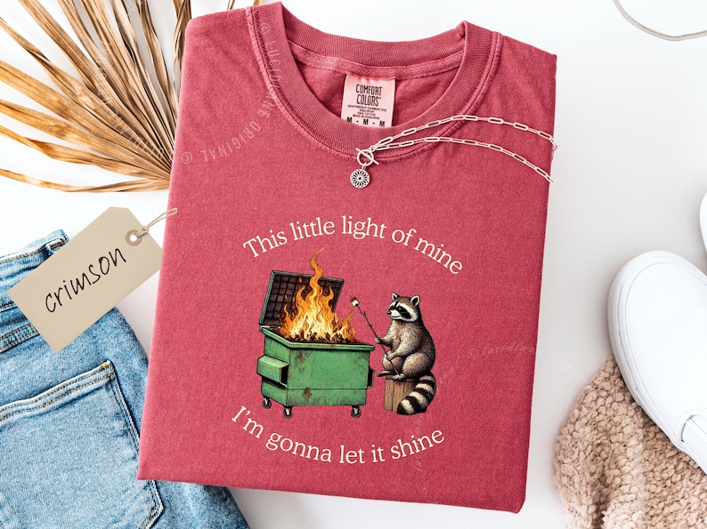 funny dumpster fire shirt, dumpster fire raccoon shirt, raccoon dumpster fire meme tee, trash panda shirt, funny raccoon graphic tee, this little light of mine parody shirt, chaotic raccoon shirt, anxiety humor shirt, funny meme t shirt, roasting marshmallow raccoon tee, comfort colors funny shirt, ironic humor tee, relatable humor shirt, chaos meme shirt, funny animal meme shirt, satirical graphic tee, unhinged raccoon tee, funny gift shirt, mental health meme tee, sarcastic tee, viral shirt