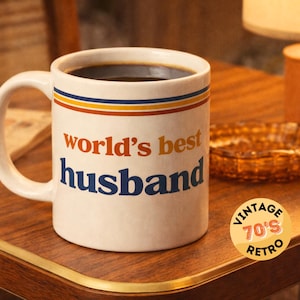 retro 70s World’s best husband mug. husband mug gift idea, perfect husband gift for Valentine’s Day, anniversary gift for husband, birthday gift for husband, husband coffee mug, husband tea mug, romantic gift for spouse, gift for him, sentimental husband present, personalised style husband mug, retro coffee mug for husbands, marriage gift, couples gift, daily coffee cup for husbands, thoughtful husband keepsake, vintage inspired mug for men.