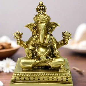 Golden Ganesha Statue: Intricately Carved Resin Hindu Idol