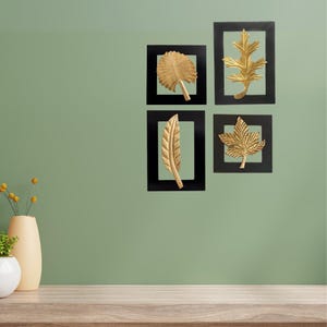 Decoração de parede com folhas douradas | Decoração elegante e moderna com natureza para sala de estar