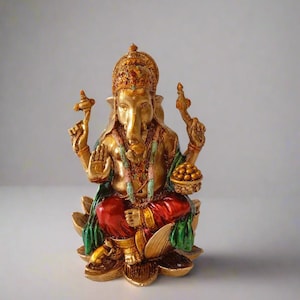 Copper Finish Lord Ganesha Idol seated on Lotus – Symbol of Good Luck & New Beginnings.