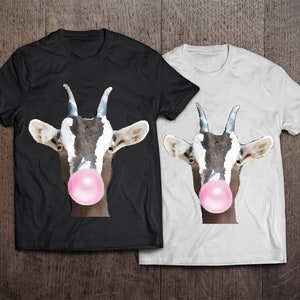 May include: Two t-shirts with a graphic of a goat with a pink bubble of gum in its mouth. One t-shirt is black and the other is white.