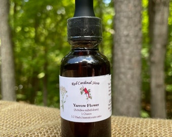 May include: A brown glass bottle with a black dropper top, labeled "Red Cardinal Store" and "Yarrow Flower (Achillea millefolium) 1 Ounce 1:2 Herb/menstruum ratio".
