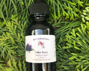 May include: A dark glass bottle with a dropper top, labelled "Red Cardinal Store" and "Elder Berry (Sambucus nigra) 1 Ounce 1:2 Herb/menstruum ratio".