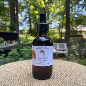 May include: A 2 ounce bottle of Papaya Seed tincture with a 1:2 herb to menstruum ratio. The bottle is labelled "Red Cardinal Store" and features a small illustration of a papaya.