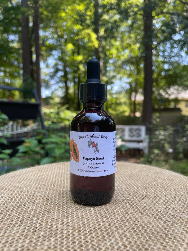 May include: A 2 ounce bottle of Papaya Seed tincture with a 1:2 herb to menstruum ratio. The bottle is labelled "Red Cardinal Store" and features a small illustration of a papaya.
