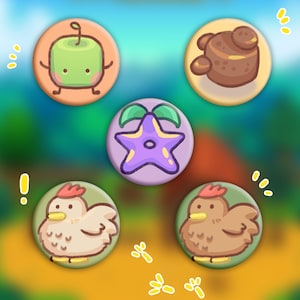 May include: A collection of five circular pinback buttons with cartoon illustrations. The designs include a green apple character, a brown bear-like creature, a purple starfish, and two different chickens. Each button has a colorful border.