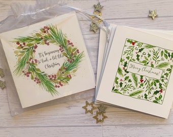 Pack of  Christmas cards.  Beautiful simple botanical foliage based cards in festive green and red. Hand foiled.   Luxury cards