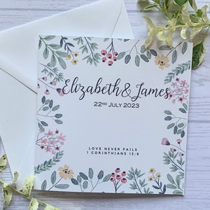 Personalised Christian wedding card with beautiful ditsy flowers  embellished with tiny rhinestones. 1 Corinthians 13:8 Love never fails.