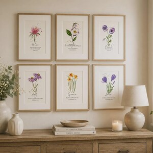 May include: A set of six framed wall art prints featuring watercolour botanical illustrations of flowers with inspirational text. Each print displays a unique floral subject, including pink, purple, and yellow blossoms, paired with script lettering.