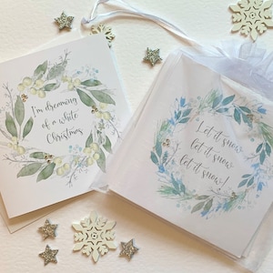 Pack of Christmas cards.  Beautiful hand  embellished Christmas wreaths surrounding seasonal messages. Luxury  cards