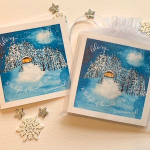 Cartes de Noël chrétiennes. Belle scène d'hiver confortable à l'aquarelle agrémentée de points déjoués. Gloire à la Lumière du monde, Emmanuel