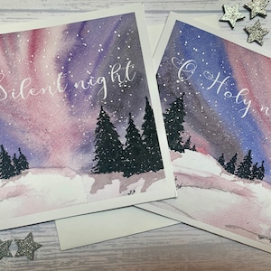 Lot de cartes de Noël de luxe.  Belle scène de neige embellie à la main avec Silent night et O Holy night écrits dans le ciel