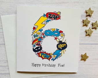 Superhero personalised 6th  birthday card . Cartoon style watercolour illustration of the number 6 embellished with silver metallic detail.