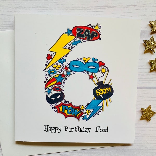 Superhero personalised 6th  birthday card . Cartoon style watercolour illustration of the number 6 embellished with silver metallic detail.