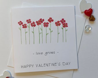 Flower Valentine Card. Watercolour red flowers. Diamante details. Love grows. Happy Valentines Day.