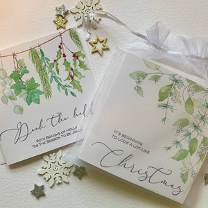 Pack of Christmas cards.  Beautiful hand  embellished  botanical Christmas designs with seasonal messages. Deck the Halls. Luxurycards