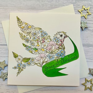 Paquet de cartes de Noël.  Belle colombe de la paix portant une bannière avec les mots « Paix à Noël ».  Cartes de luxe