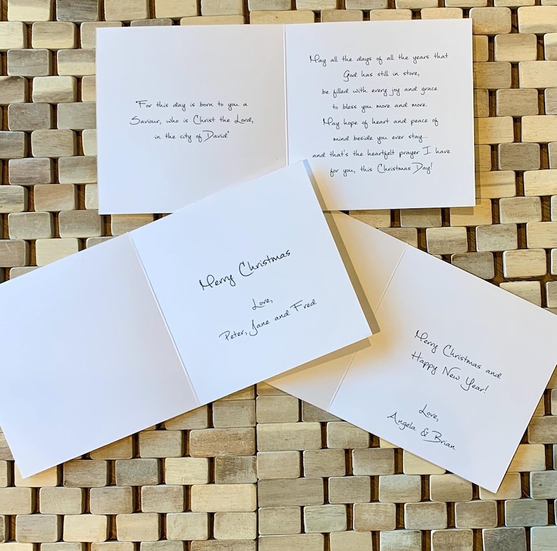 May include: Three folded Christmas cards with handwritten messages. The cards are white with black ink. The first card has a religious quote about the birth of Jesus. The second card says "Merry Christmas" with the names Peter, Jane, and Fred. The third card says "Merry Christmas and Happy New Year!" with the names Angela and Brian.