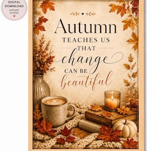 May include: A framed wall art print featuring the text Autumn teaches us that change can be beautiful, surrounded by orange maple leaves, a ceramic mug with latte art, a vase of dried flowers, two stacked books, and a small white pumpkin.