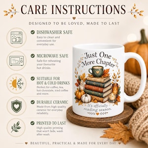 May include: A white ceramic mug featuring a stack of books, a small cup, pumpkins, and autumn leaves. The text reads Just One More Chapter and It's officially reading season. The image includes a list of care instructions for dishwasher and microwave use.