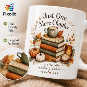 May include: A white ceramic mug featuring a stack of books, pumpkins, autumn leaves, and a candle. The text reads Just One More Chapter and It's officially reading season. The design includes a small heart icon and a decorative botanical wreath.