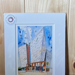 May include: Watercolour print depicting the Titanic Belfast building. The artwork shows a modern architectural design with the word "Titanic" in large letters. Signed by artist Gillian Boyd.