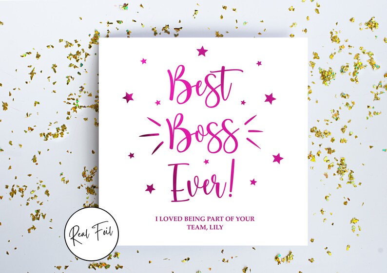 May include: A square white greeting card featuring magenta foil text that reads Best Boss Ever! with small stars and decorative lines. Below the main text, it reads I LOVED BEING PART OF YOUR TEAM, LILY. A circular badge on the card says Real Foil.