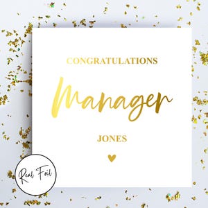 May include: White card with gold foil text: "CONGRATULATIONS Manager JONES" and a heart. Gold confetti surrounds the card. A "Real Foil" logo is visible.