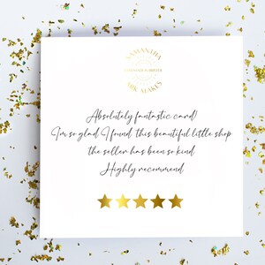 May include: A square white card featuring a gold logo at the top that reads SAMANTHA ARK MAKES HANDMADE IN BRISTOL. Below is black cursive text: Absolutely fantastic card! I'm so glad I found this beautiful little shop the seller has been so kind Highly recommend. Five gold stars are printed at the bottom.