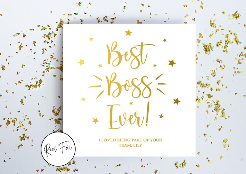 May include: A square white greeting card featuring gold foil text that reads Best Boss Ever! with decorative stars. Below the main text, it says I LOVED BEING PART OF YOUR TEAM, LILY. A circular badge on the card indicates Real Foil.