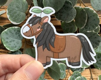 May include: A brown horse with a black mane and tail, wearing a brown saddle and a green plant growing on its head. The horse is cartoon-style and has a friendly expression.