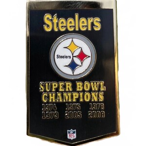 May include: A black and gold Steelers pin with the team logo and the words "Steelers" and "Super Bowl Champions." The pin lists the years 1974, 1975, 1978, 1979, 2005, and 2008. The NFL logo is at the bottom.