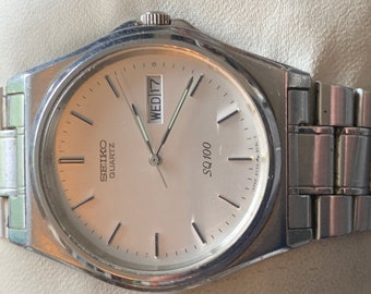 Vintage rare Seiko SQ 100 5Y23 8A50 silver tone Mens watch with with date function