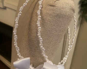 Classic Stefana, beautiful classic pearl stones with a white satin ribbon.  Created for your Orthodox wedding.