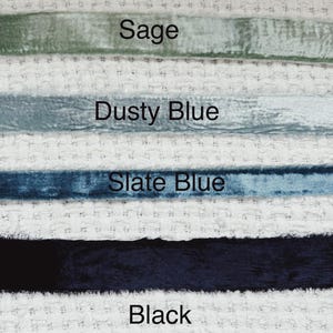 May include: Four velvet ribbon samples in different colors: sage green, dusty blue, slate blue, and black.