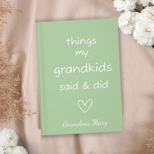 May include: A light green journal with the text "things my grandkids said & did" and a heart symbol. The text "Grandma Mary" is at the bottom of the journal.