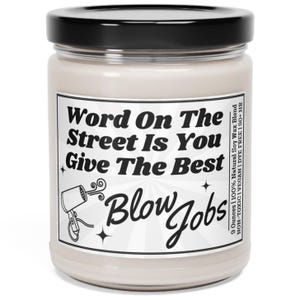 Soy Vegan Candle in Reusable Glass Jar with Black Lid. Detailed Label says "Word on the street is you give the best blow jobs" with a picture of a hairdryer
