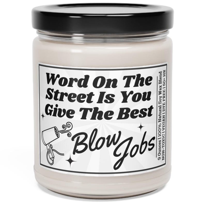 Soy Vegan Candle in Reusable Glass Jar with Black Lid. Detailed Label says "Word on the street is you give the best blow jobs" with a picture of a hairdryer