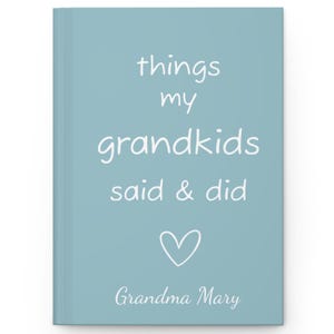 May include: A light blue journal with the text "things my grandkids said & did" in white. A white heart is below the text and the name "Grandma Mary" is at the bottom.