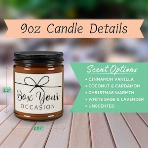 May include: A 9 ounce amber glass candle jar with a black lid. The jar has a white label with the text "Box Your Occasion" and a black ribbon design. The candle is 3.5 inches tall and 2.87 inches wide. The candle is available in six scents: Cinnamon Vanilla, Coconut & Cardamom, Christmas Warmth, White Sage & Lavender, and Unscented.