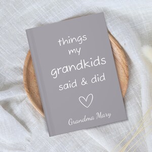 May include: A gray journal with the text "things my grandkids said & did" and a heart symbol. The bottom of the journal says "Grandma Mary".