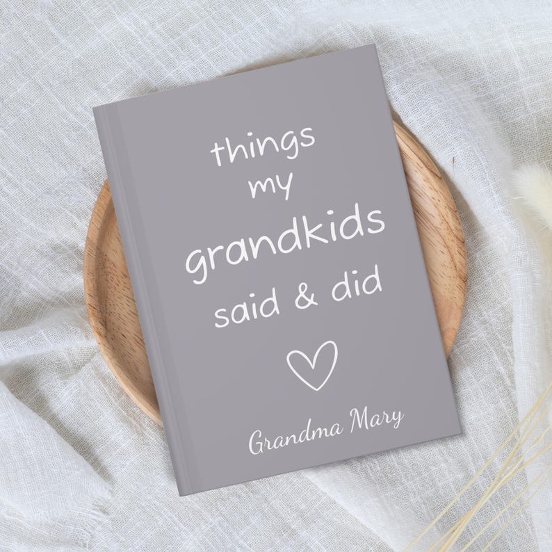May include: A gray journal with the text "things my grandkids said & did" and a heart symbol. The bottom of the journal says "Grandma Mary".