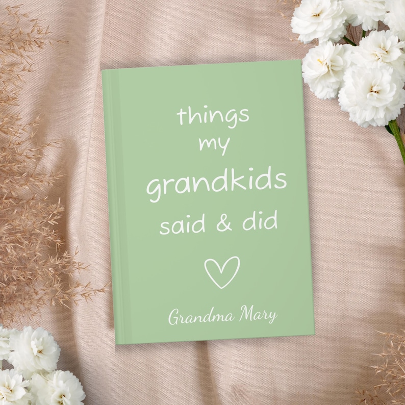 May include: A light green journal with the text "things my grandkids said & did" and a heart symbol. The text "Grandma Mary" is at the bottom of the journal.